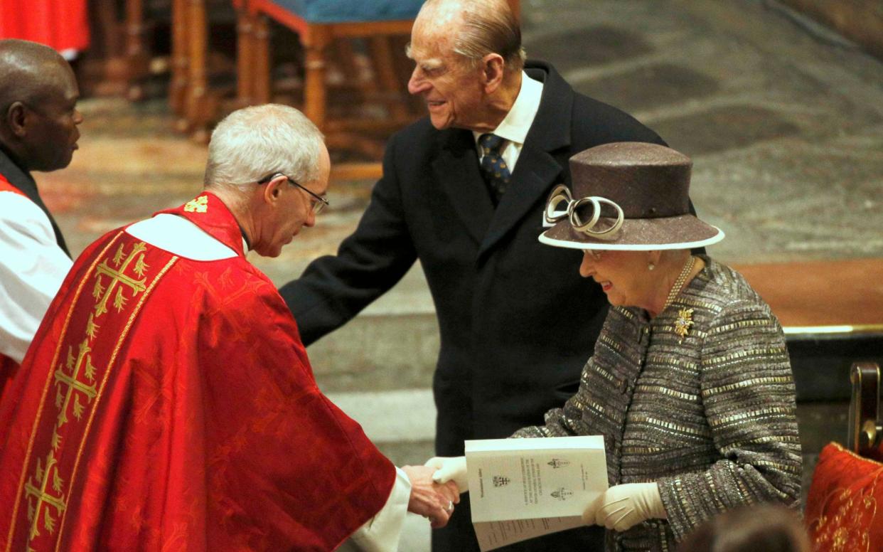 The Queen and Prince Philip are greeted by the Archbishop of Canterbury at Westminster Abbey - Getty