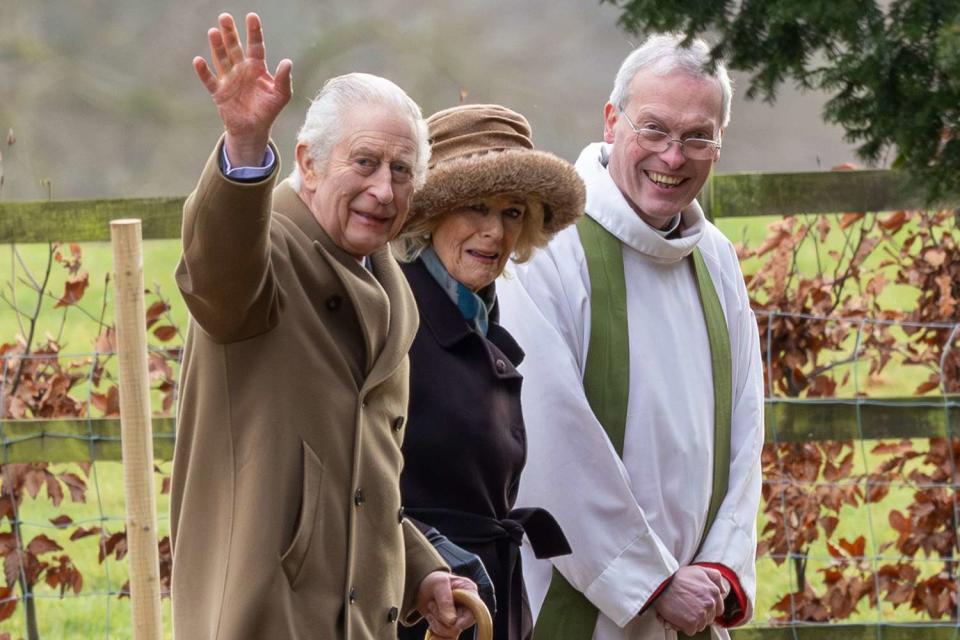 <p>Geoff Robinson/SplashNews</p> King Charles waves to well-wishes at Sandringham with Queen Camilla