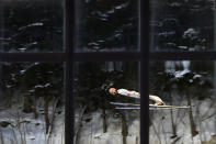 Manuel Fettner of Austria soars through the air during the men's Normal Hill Individual jumping competition at the FIS Nordic Skiing World championships in the northern mountain resort of Predazzo in Val di Fiemme February 23, 2013. REUTERS/Giampiero Sposito (ITALY - Tags: SPORT SKIING TPX IMAGES OF THE DAY) - RTR3E6BH