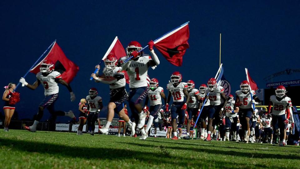 Manatee High runs onto the field in Venice on Friday, Oct. 6, 2023.