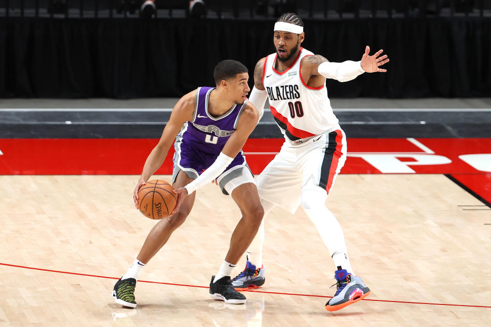 Sacramento Kings rookie Tyrese Haliburton works against Portland Trail Blazers forward Carmelo Anthony during their preseason game.