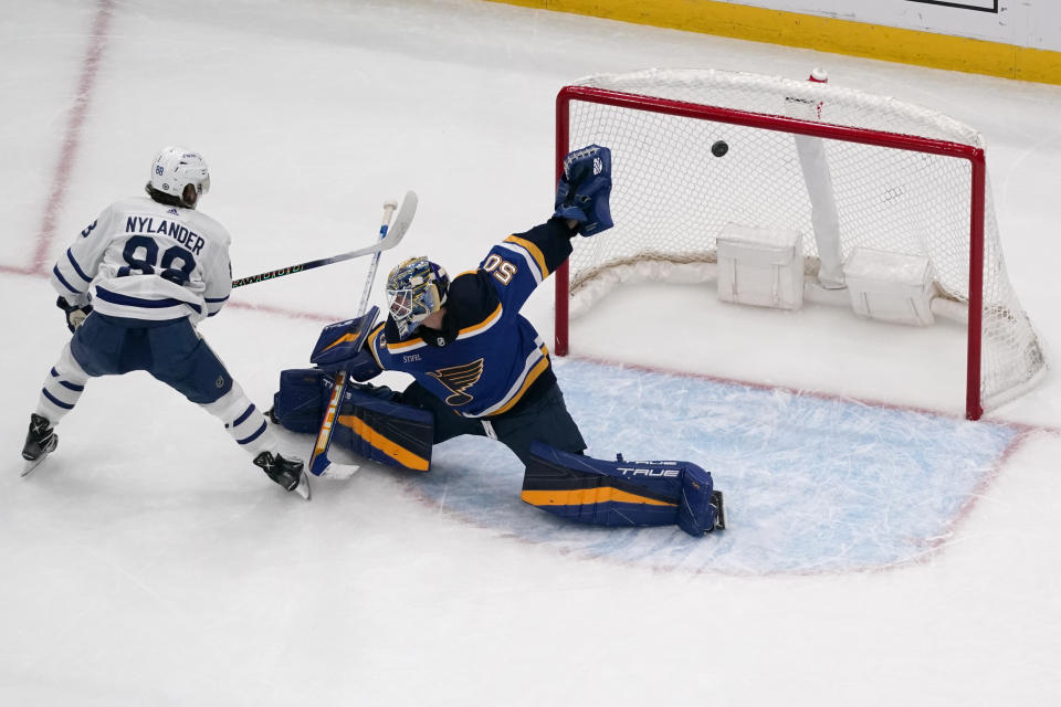 Toronto Maple Leafs' William Nylander (88) scores the game-winning goal past St. Louis Blues goaltender Jordan Binnington during overtime of an NHL hockey game Tuesday, Dec. 27, 2022, in St. Louis. (AP Photo/Jeff Roberson)