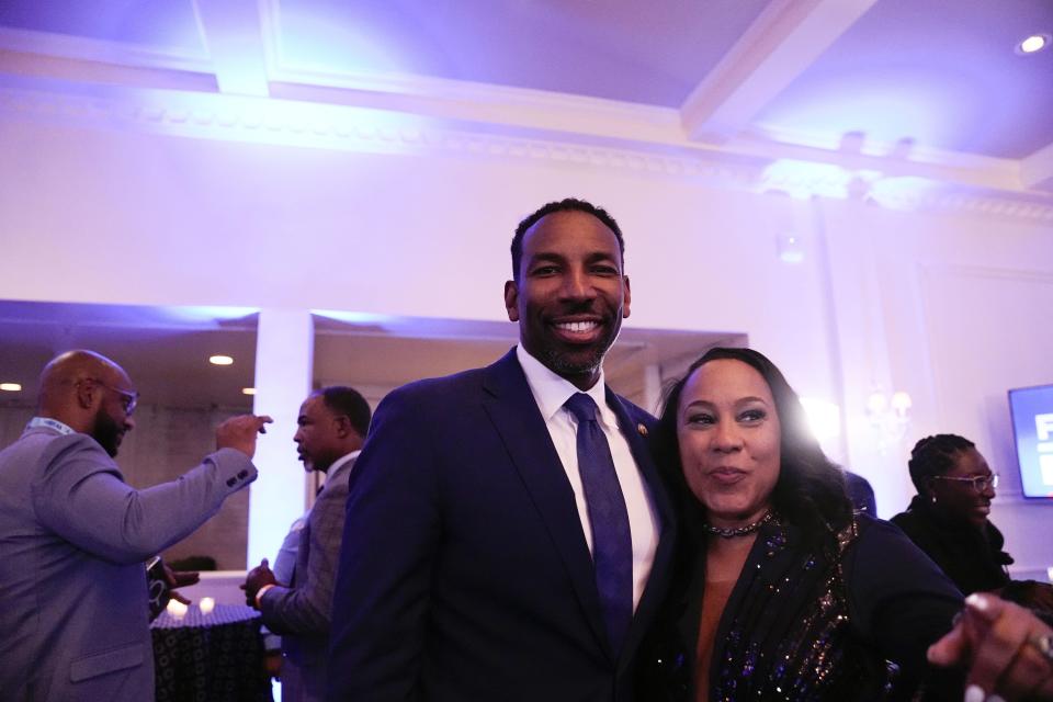Atlanta Mayor Andre Dickens takes a photograph with Fulton County District Attorney Fani Willis before she speaks and after winning re-election in the primary on Tuesday, May 21, 2024, in Buckhead, Ga. (AP Photo/Brynn Anderson)