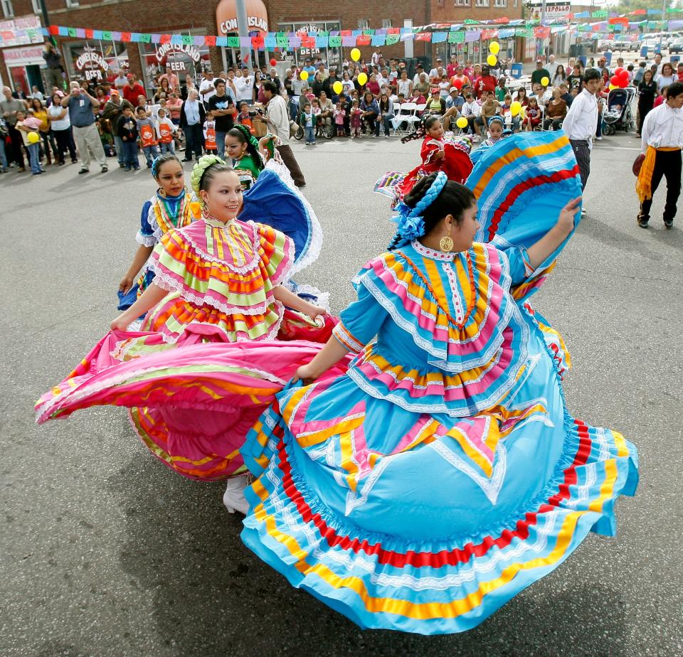Crowds enjoy the dance performance of the Mexican Folkloric Dancers during the Fiestas de las Americas, an annual festival and parade in Capitol Hill.