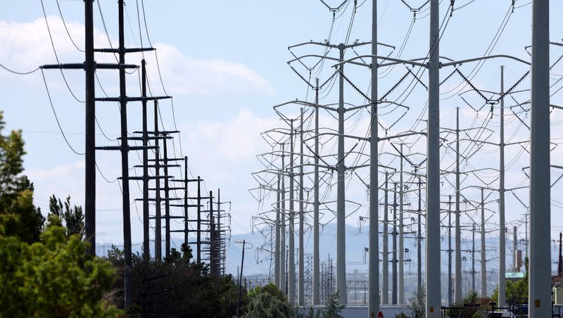 High-tension power lines run along Wright Brothers Drive near the Salt Lake City International Airport in Salt Lake City on May 24, 2022.
