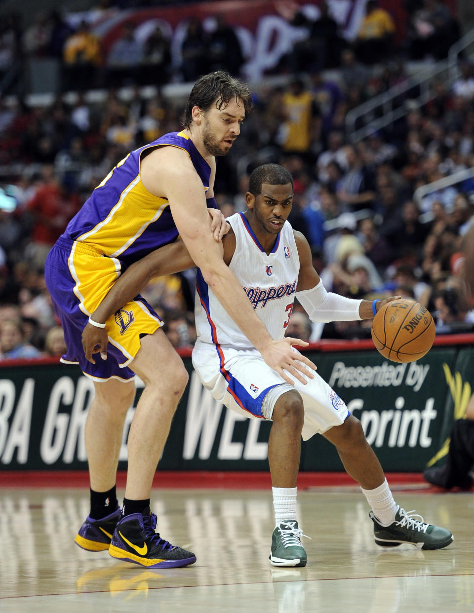 Chris Paul of the Los Angeles Clippers keeps the ball from Pau Gasol of the Los Angeles Lakers during a 113-108 Laker win at Staples Center on April 4, 2012 in Los Angeles, California. (Photo by Harry How/Getty Images)