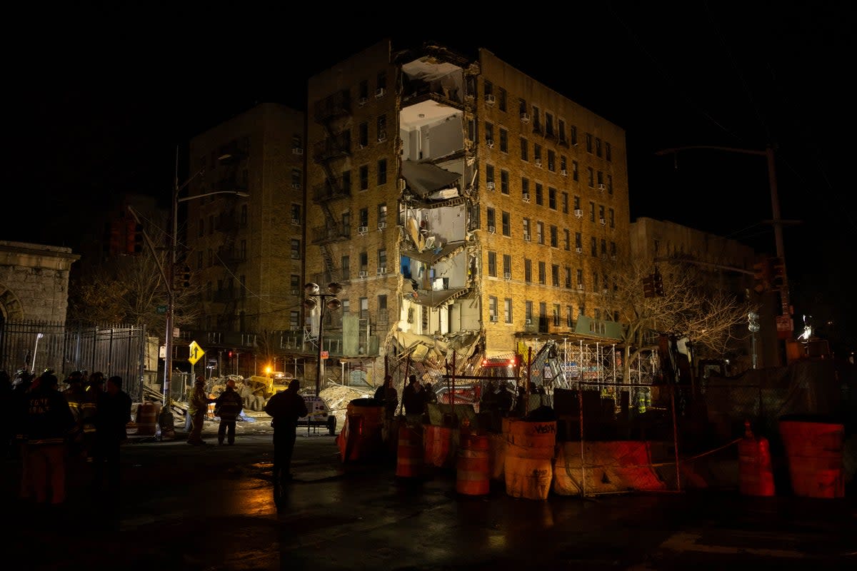 First responders stand at the scene of a collapsed building in the Bronx  (AP)