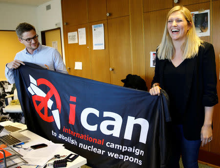 Beatrice Fihn, Executive Director of the International Campaign to Abolish Nuclear Weapons (ICAN) and Daniel Hogsta, coordinator, celebrate after winning the Nobel Peace Prize 2017, in Geneva, Switzerland October 6, 2017. REUTERS/Denis Balibouse