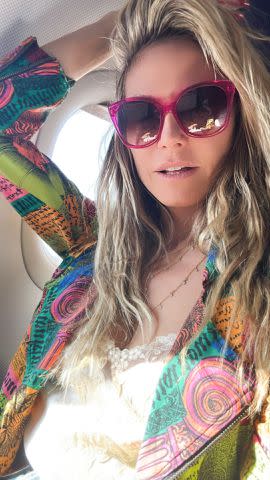 <p>Heidi Klum/ Instagram</p> Heidi Klum snaps a photo on the airplane as she jets off to Europe.