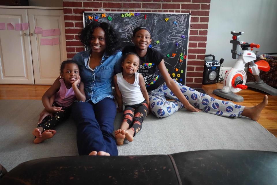 From left, Skai, 3, sits next to her mother, Shane Darby, and her two sisters, Samirah, 4, and Saniyah, 12.