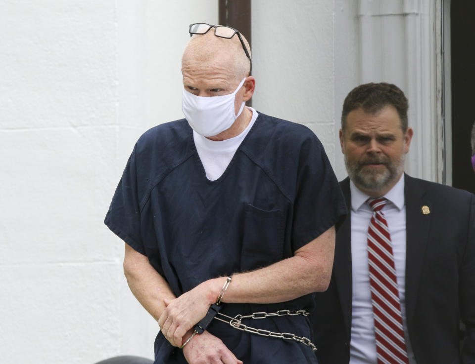 Alex Murdaugh is escorted out of the Colleton County Courthouse in Walterboro, S.C., on Wednesday, July 20, 2022. The once-powerful and now disbarred South Carolina attorney Alex Murdaugh pleaded not guilty on Wednesday to murdering his wife and son 13 months ago. His defense said Murdaugh can't afford to post any bond and wants a speedy trial because "he believes the killer or killers are still at large.” (Tracy Glantz/The State via AP)