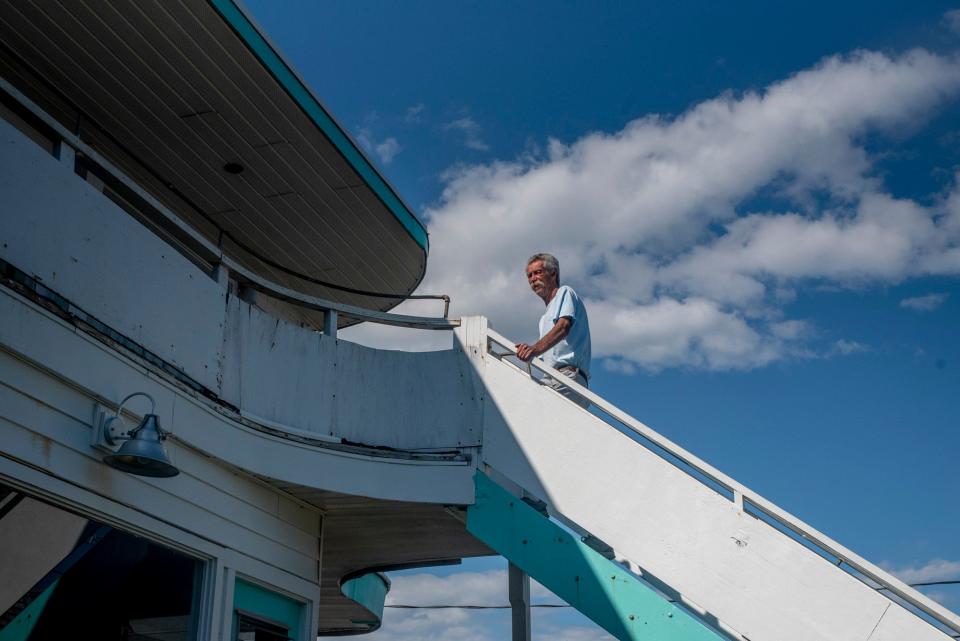 Owner of the Nevada Motel Paul de la Pena, 65, poses at the Long Beach Avenue motel in York, Maine on July 28, 2021.