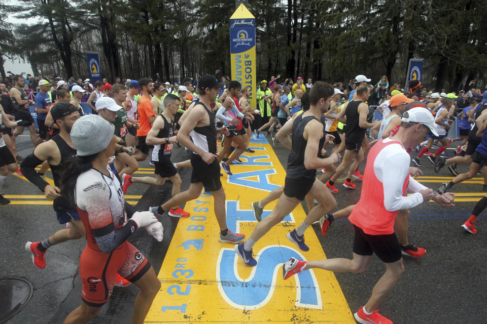 Runners cross the start line of the 123rd Boston Marathon on Monday, April 15, 2019, in Hopkinton, Mass. (AP Photo/Stew Milne)