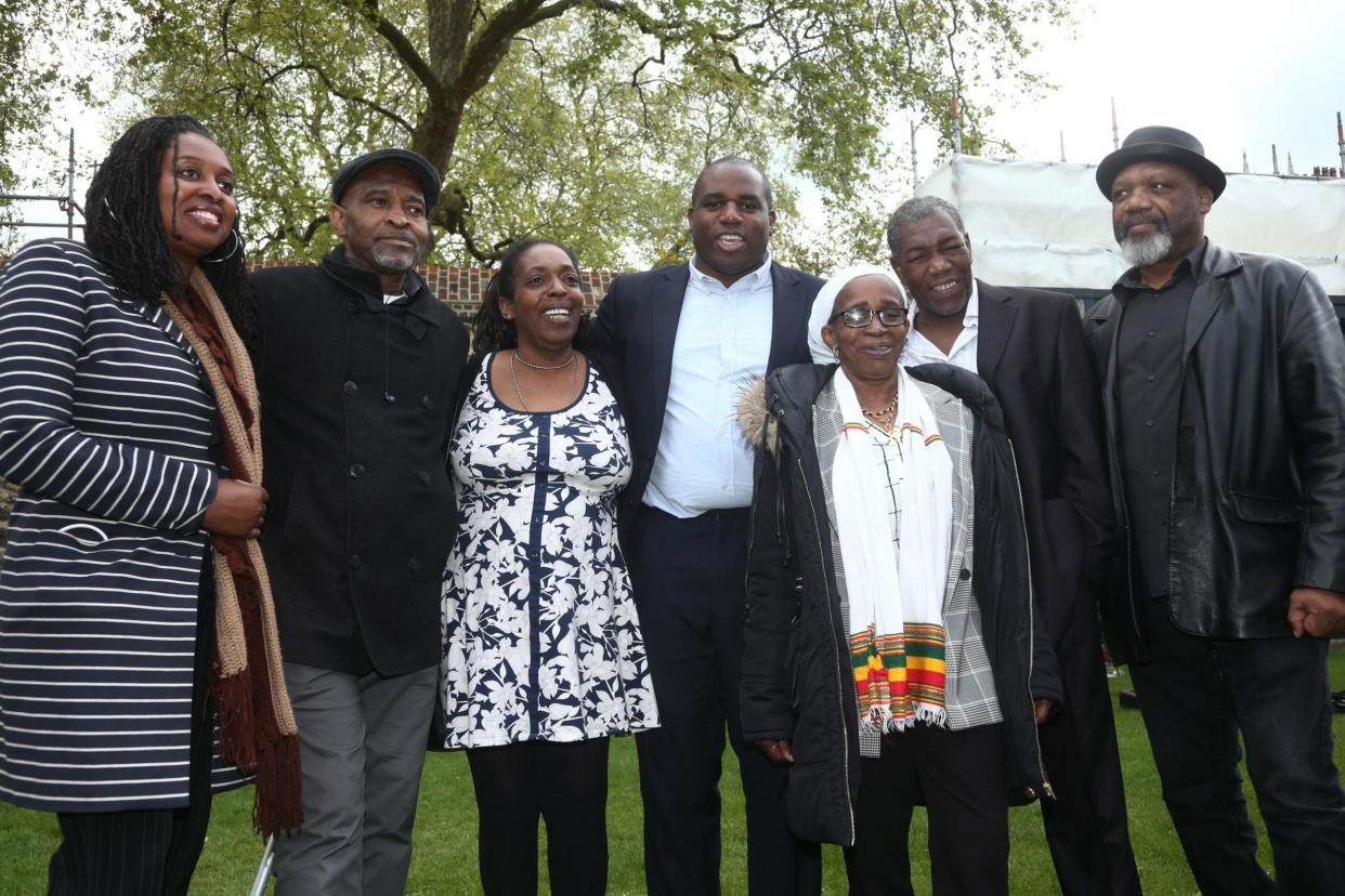 Anthony Bryan with Labour MPs David Lammy and Dawn Butler and other members of the Windrush generation (PA)