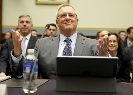 Bruce Sewell, senior vice president and general counsel for Apple Inc., prepares to testify to the House Judiciary hearing on "The Encryption Tightrope: Balancing Americans' Security and Privacy" on Capitol Hill in Washington March 1, 2016. REUTERS/Joshua Roberts