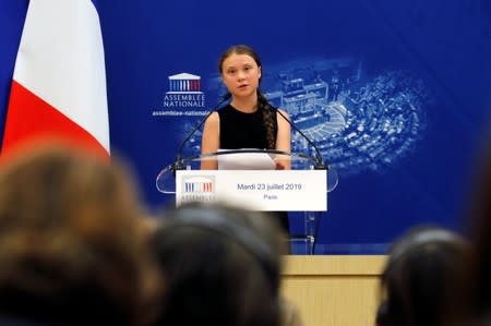 Swedish environmental activist Greta Thunberg delivers a speech during a debate with French parliament members at the National Assembly in Paris