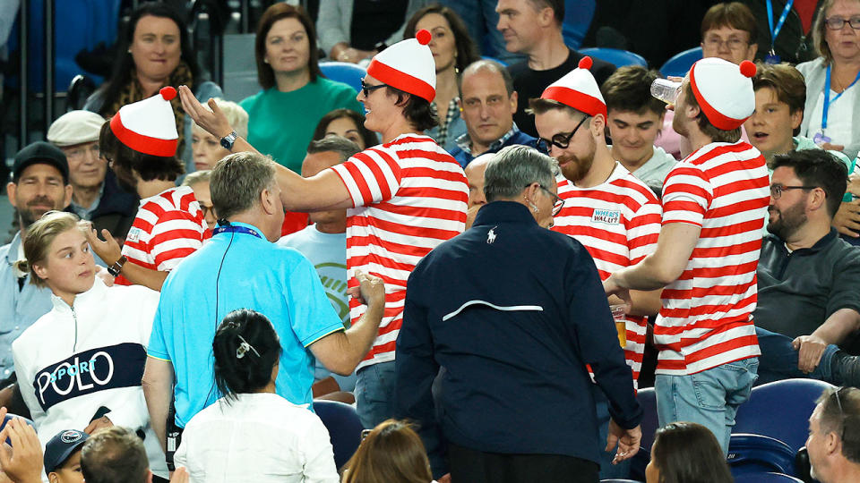 Pictured here, a group of fans in fancy dress were ejected late on in the Djokovic match. 