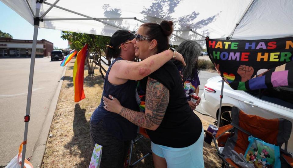 People have been protesting Stedfast Baptist Church for about a year, but the rallies grew after the pastor, Jonathan Shelley, asked the Arlington City Council to revoke a Pride Month proclamation and reiterated his calls for the criminalization of homosexuality and legal execution of gay people. Brandy Sottilo, an organizer with No Hate in Texas, hugs Mandi Skinner as they get ready for a day of protesting outside Stedfast’s church in a Watauga shopping center. Sottilo started protests in Hurst and has continued them at Stedfast’s new location. Police have talked to both sides, maintaining that the church has not violated any law.