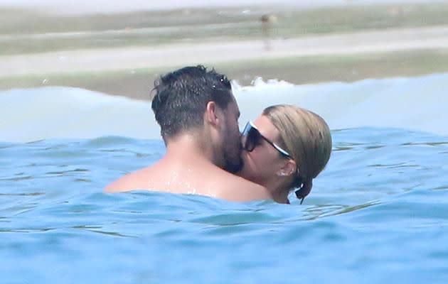 The couple were seen swimming together and indulging in some serious PDA. Source: Splash