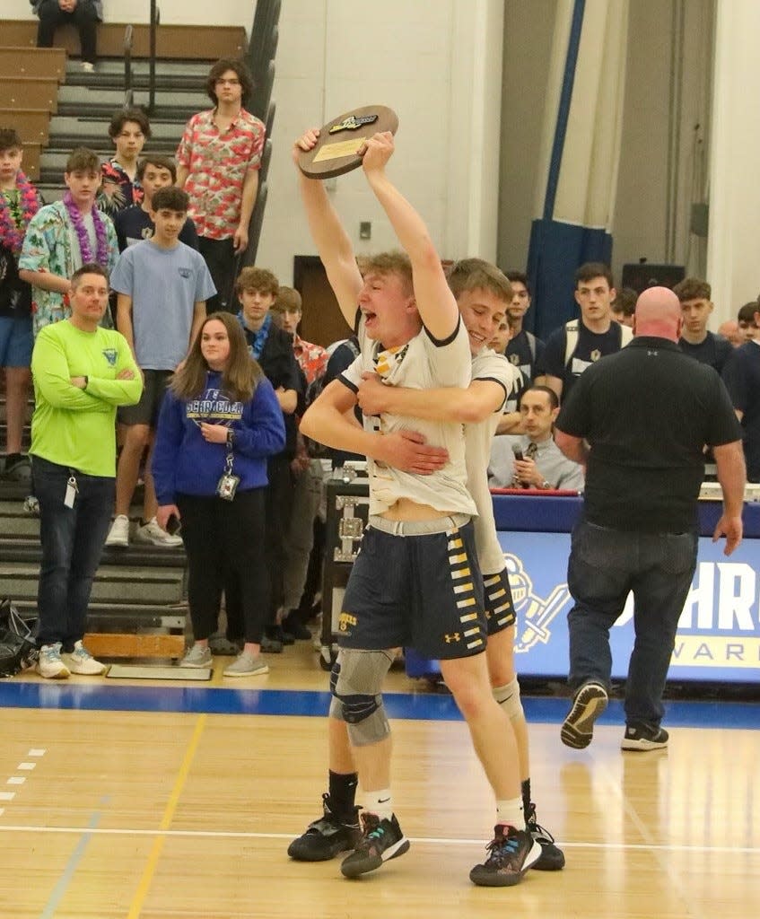 Brody Jackson hugs Shaun Cannon after Spencerport's five-set win over East Aurora/Holland in the NYSPHSAA Far West Regionals on Saturday, Nov. 12, 2021 at Webster Schroeder.