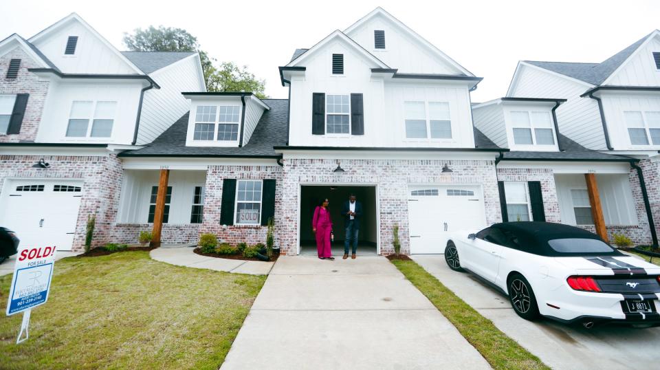 Realtor Jay McMiller talks with buyer Jacquator Ferguson after a tour of the home she just bought on Tuesday, April 9, 2024, in Southaven, Miss.