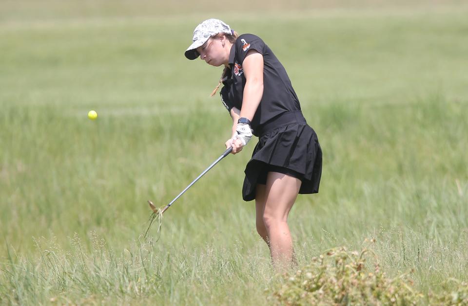 Ames'  Leah Becker chips the ball from the rough onto the 9th hole green during the 4A girls state golf tournament at Otter Creek Golf Course on Thursday, May 25, 2023, in Ankeny, Iowa.