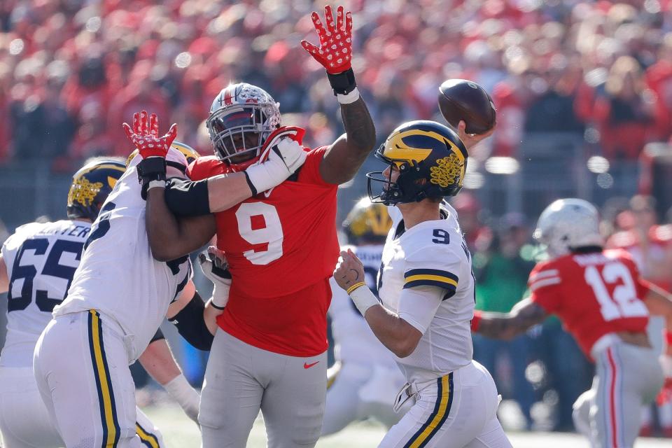 Michigan quarterback J.J. McCarthy (9) attempts a pass against Ohio State during the first half at Ohio Stadium in Columbus on Nov. 26, 2022.