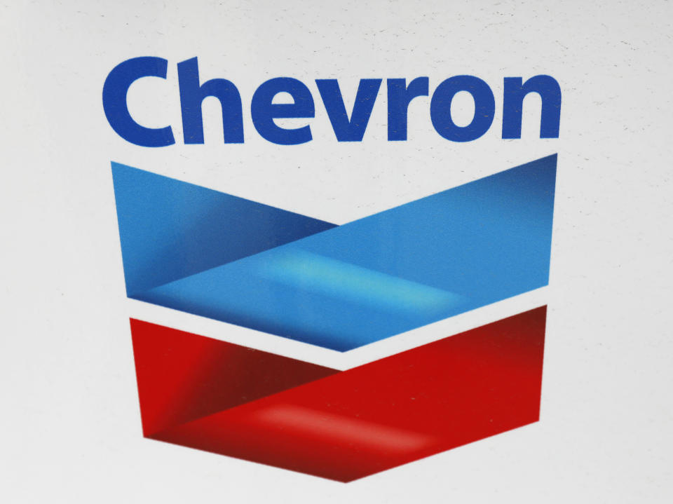 FILE - In this Wednesday, June 26, 2019, file photo, a Chevron corporate logo is displayed on a gas pump in Flowood, Miss. Warren Buffett’s company made major new investments in Verizon and Chevron and again trimmed its huge stake in Apple while making several other adjustments to its stock portfolio last year. Berkshire Hathaway said in a regulatory filing Tuesday, Feb. 16, 2021, that it bought $8.6 billion worth of Verizon stock and picked up $4 billion worth of Chevron shares over the last six months of 2020. (AP Photo/Rogelio V. Solis, File)