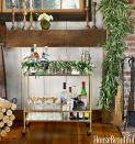 <p>Bar carts are the one design element that still need to be functional, so make sure <a href="https://www.housebeautiful.com/entertaining/holidays-celebrations/a4903/bryan-rafanelli-christmas-party/" rel="nofollow noopener" target="_blank" data-ylk="slk:all of your merry-making essentials;elm:context_link;itc:0;sec:content-canvas" class="link ">all of your merry-making essentials</a> fit. Accessorize with greenery and glassware. </p>