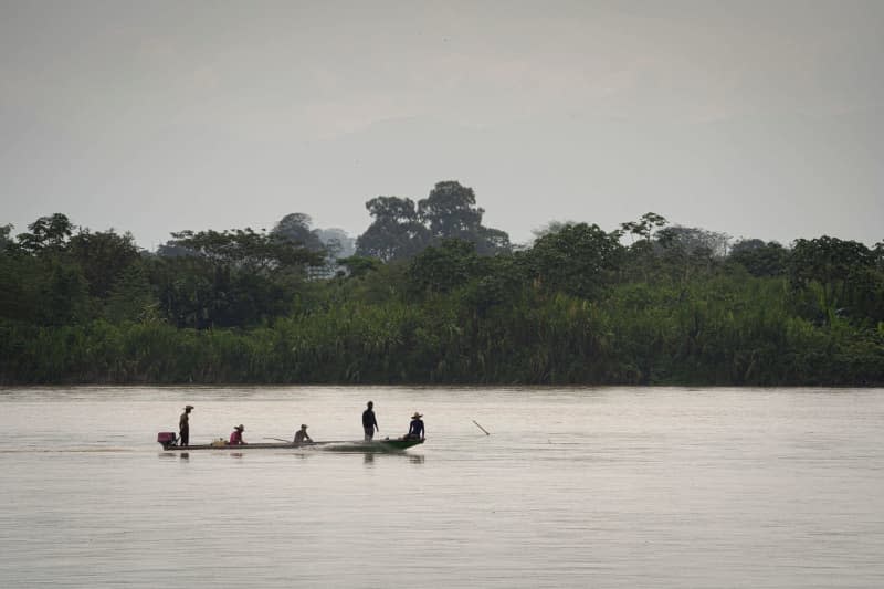 Fishermen on Colombia's Rio Magdalena river. Drug lord Pablo Escobar brought four hippos to Colombia during the 1980s, to live alongside elephants, giraffes, kangaroos and other exotic animals in his private zoo on the luxury estate Hacienda Napolés, outside Medellín. After his death, the hippos escaped and have since proliferated vigorously, with many said to live around the river. Luis Bernardo Cano/dpa