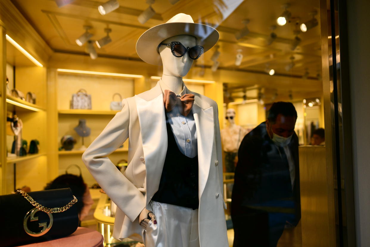 SAINT TROPEZ, FRANCE  - AUGUST 11: Man arranges the window of the Gucci luxury store on August 11, 2022 in Saint Tropez, France. Saint-Tropez is a town on the French Riviera which is part of the Provence-Alpes-Côte d'Azur region in southeastern France knownfor its beaches and nightlife. (Photo by Stefano Guidi/Getty Images)