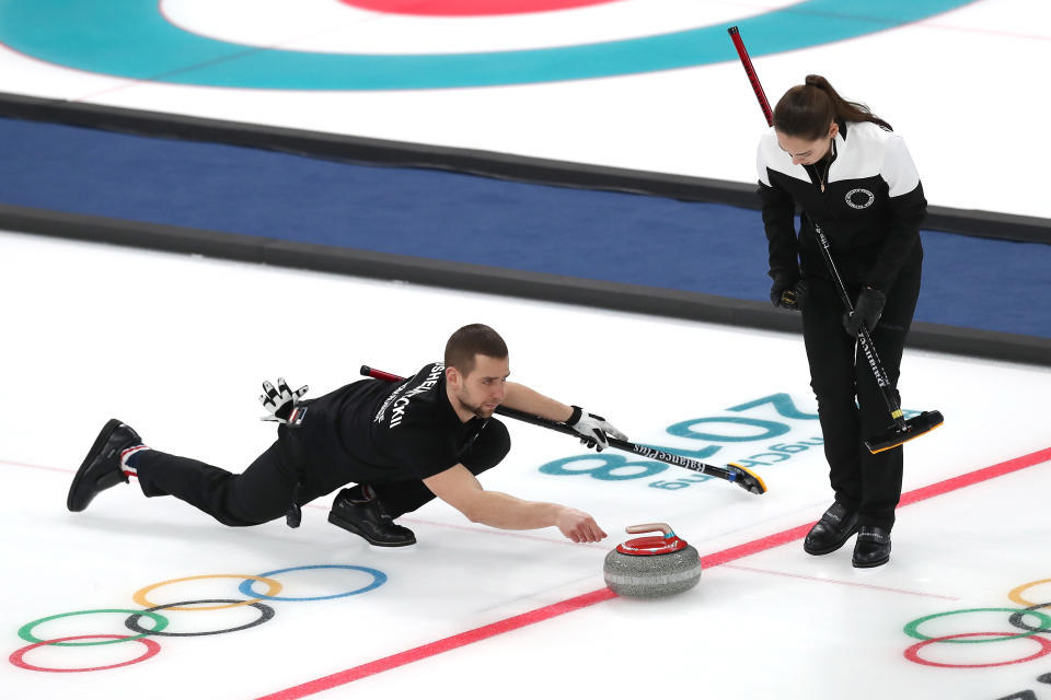 Aleksandr Krushelnitckii delivers a stone during the 2018 Olympics at PyeongChang. (Getty Images)