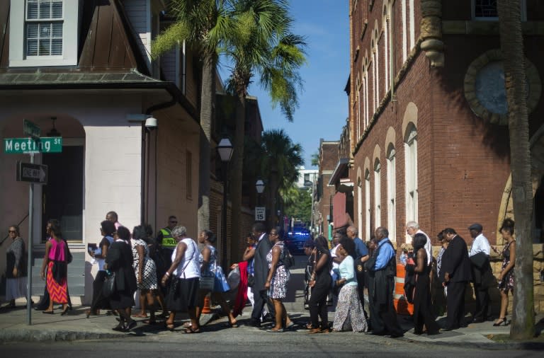 Members of the public stand in line to attend Emanuel AME Church Pastor and State Sen. Clementa Pinckney's funeral at College of Charleston's T D Arena in Charleston, South Carolina, June 26, 2015
