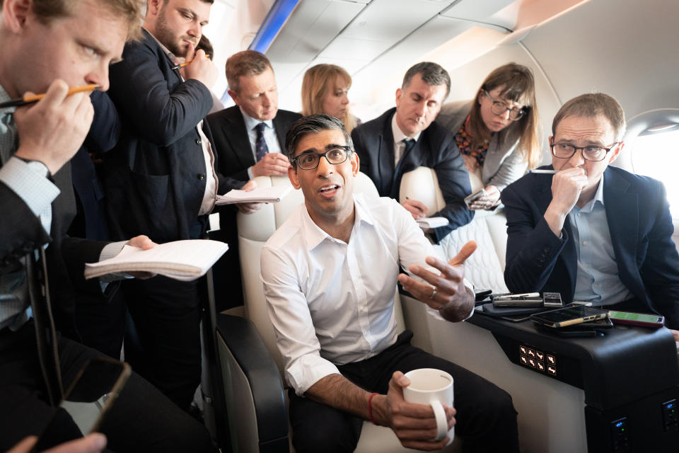 IN FLIGHT - MAY 17:  British Prime Minister Rishi Sunak holds a huddle with political journalists on board a government plane as he heads to Japan to attend the G7 summit in Hiroshima on May 17, 2023 in Flight. The G7 summit will be held in Hiroshima from 19-22 May. (Photo by Stefan Rousseau - WPA Pool/Getty Images)