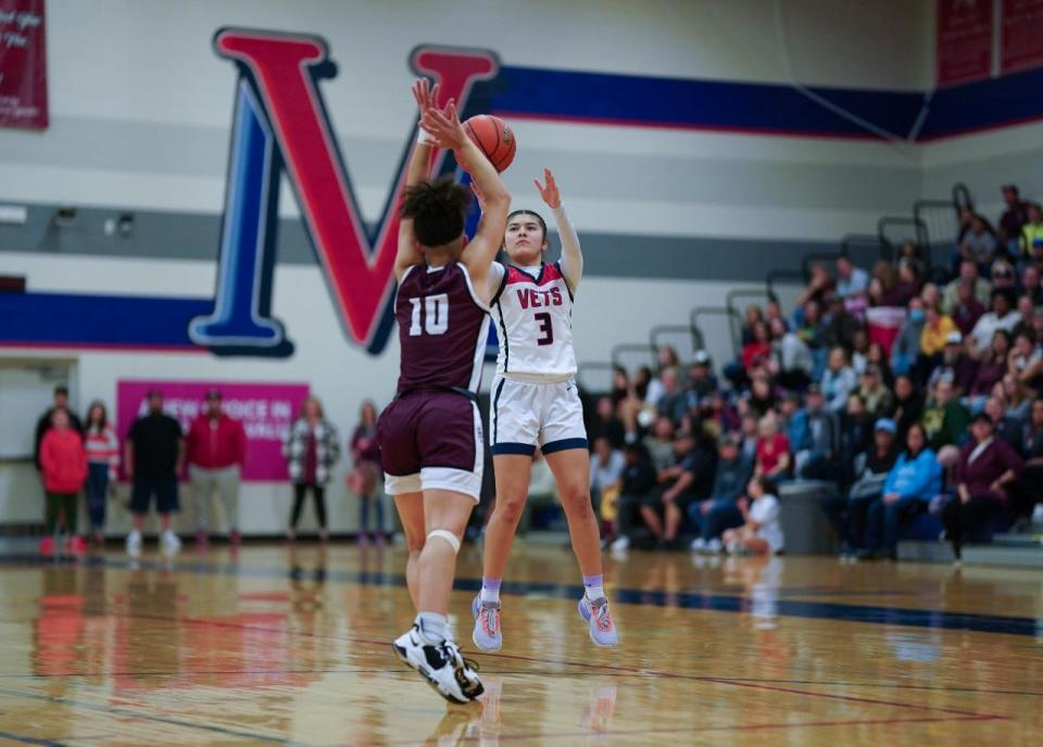 Veterans Memorial junior shooting guard Adelynn Lopez (3) shoots a 3-pointer over Flour Bluff’s Maddie Robinson (10) during Friday's District 29-5A South Zone game at Veterans Memorial High School.