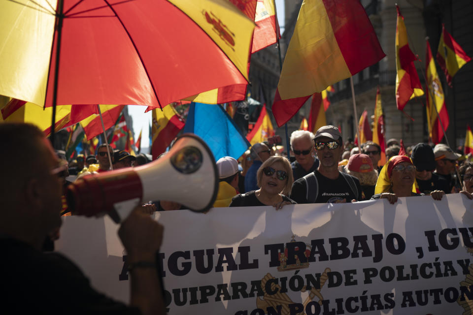 Members and supporters of National Police and Guardia Civil march during a protest demanding better pay in Barcelona, Spain, Saturday, Sept. 29, 2018. (AP Photo/Felipe Dana)