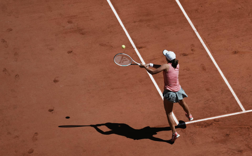 Poland's Iga Swiatek plays a return to Slovenia's Kaja Juvan during their first round match on day two of the French Open tennis tournament at Roland Garros in Paris, France, Monday, May 31, 2021. (AP Photo/Thibault Camus)