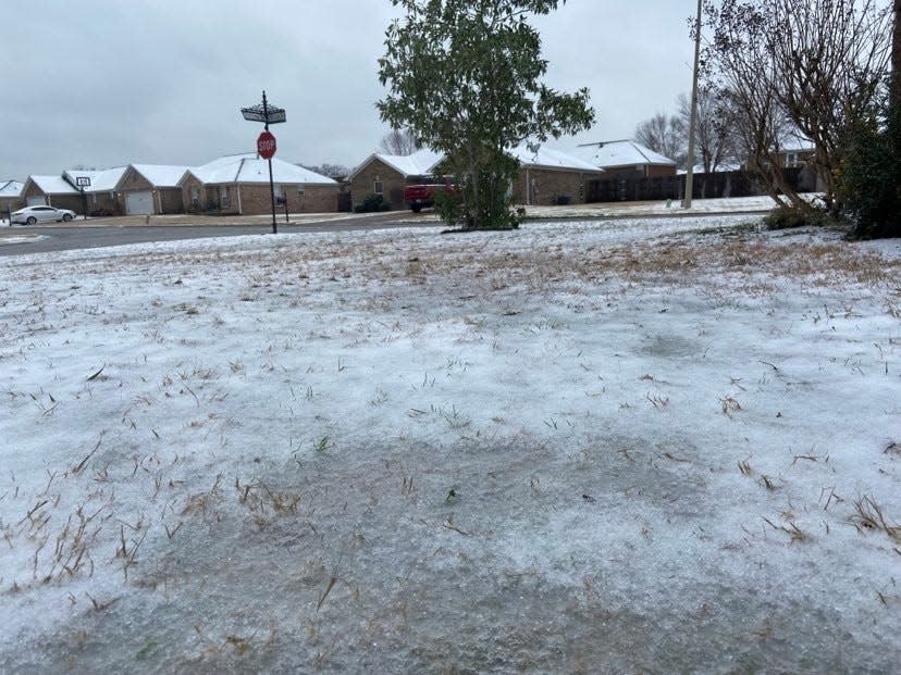 A layer of ice and snow blanket the ground in south Gibson County on Sunday, Jan. 16, 2022.