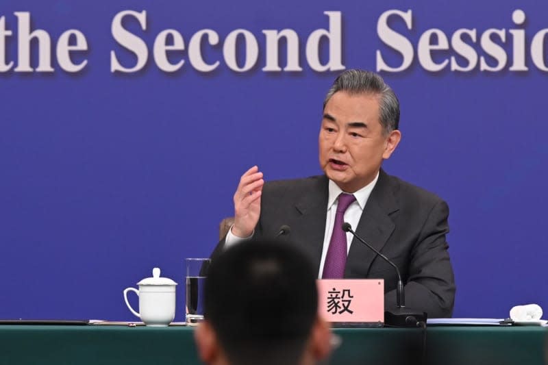 Wang Yi, China's Foreign Minister, speaks at a press conference at the National People's Congress (NPC). Johannes Neudecker/dpa