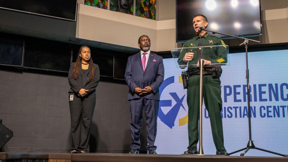 State Attorney Monique Worrell, Orange County Mayor Jerry Demings, and Orange County Sheriff John Mina stand during a press conference on community violence.