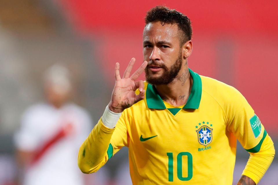 Neymar celebrates after scoring his hat-trick goal against Peru (Getty)