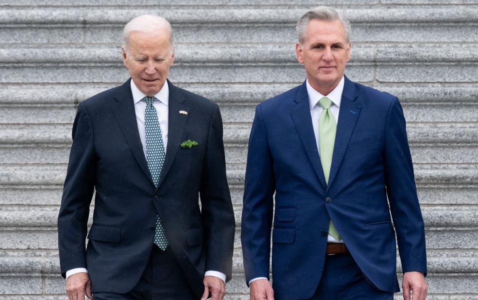 In this file photo taken on March 17, 2023, US President Joe Biden and US Speaker of the House Kevin McCarthy, Republican of California, depart after the annual Friends of Ireland luncheon at the US Capitol in Washington, DC. - President Joe Biden will convene a high-stakes meeting with Republican leaders on May 9, 2023, in hopes of breaking an impasse over the US debt limit -- with repercussions that could extend to next year&#39;s presidential election. - SAUL LOEB/AFP