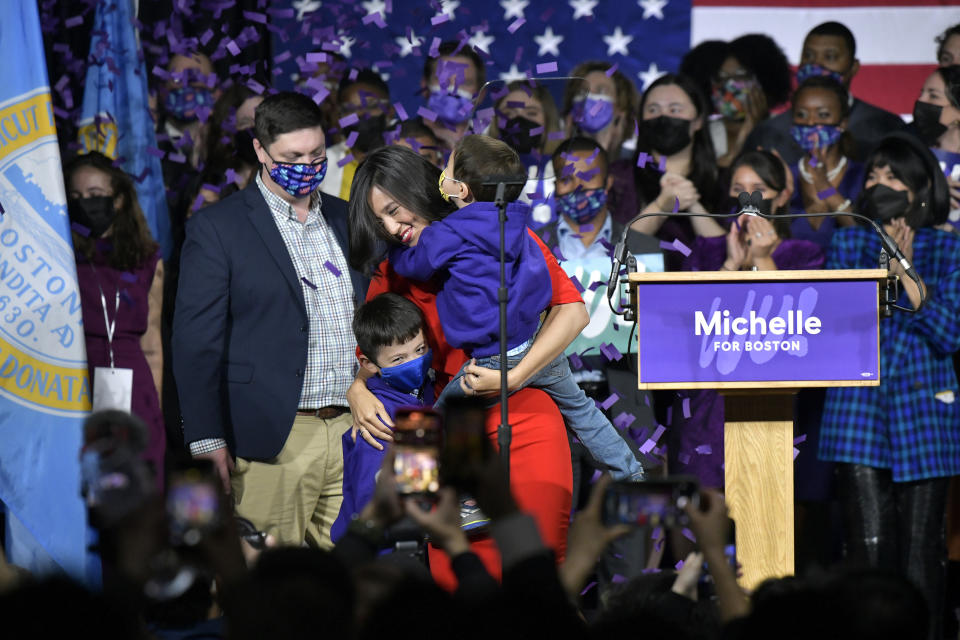 Boston Mayor-elect Michelle Wu celebrates with, from left, her husband, Conor Pewarski, and sons Blaise Francis Pewarski and Cass Wu Pewarski at her election night party, Tuesday, Nov. 2, 2021, in Boston. Boston voters for the first time elected a woman and an Asian American as mayor, tapping City Councilor Wu to serve in the city’s top political office. (AP Photo/Josh Reynolds)