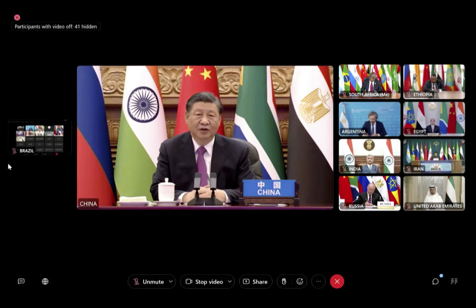 On this video framegrab of a feed distributed by South Africa's Presidency, China's Xi Jinping joins other BRICS leaders for a virtual meeting of leaders of developing countries Tuesday, Nov. 21, 2023, where South African President Cyril Ramaphosa accused Israel of war crimes, condemned Hamas for its attack on Israeli civilians that sparked the conflict and said both sides were guilty of violating international law. (AP Photo)