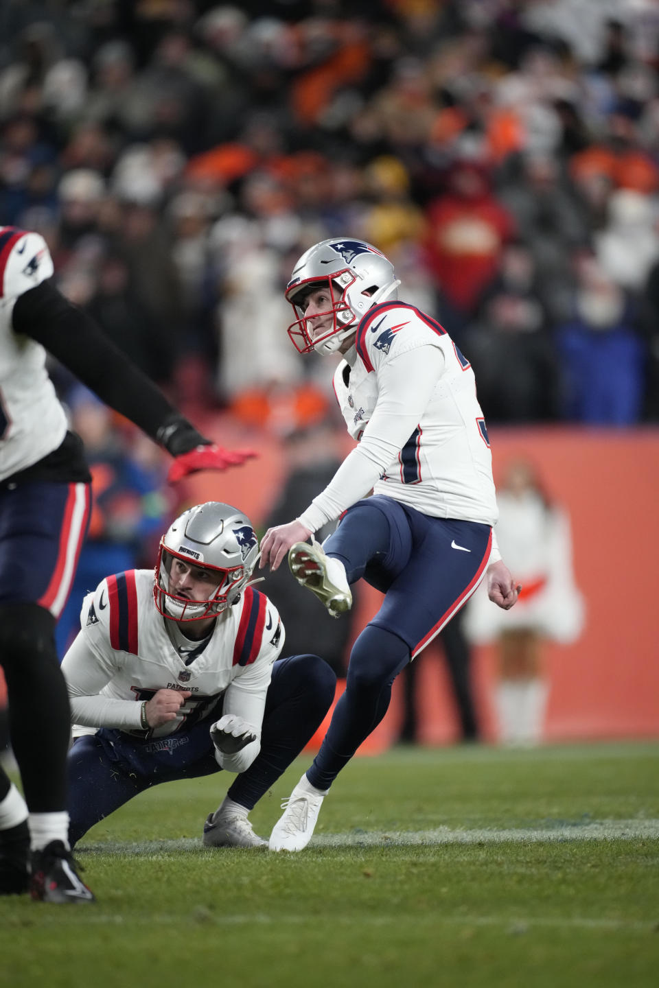 New England Patriots place-kicker Chad Ryland (37) kicks the game winning field goal with second left during the second half of an NFL football game against the Denver Broncos, Sunday, Dec. 24, 2023, in Denver. (AP Photo/David Zalubowski)