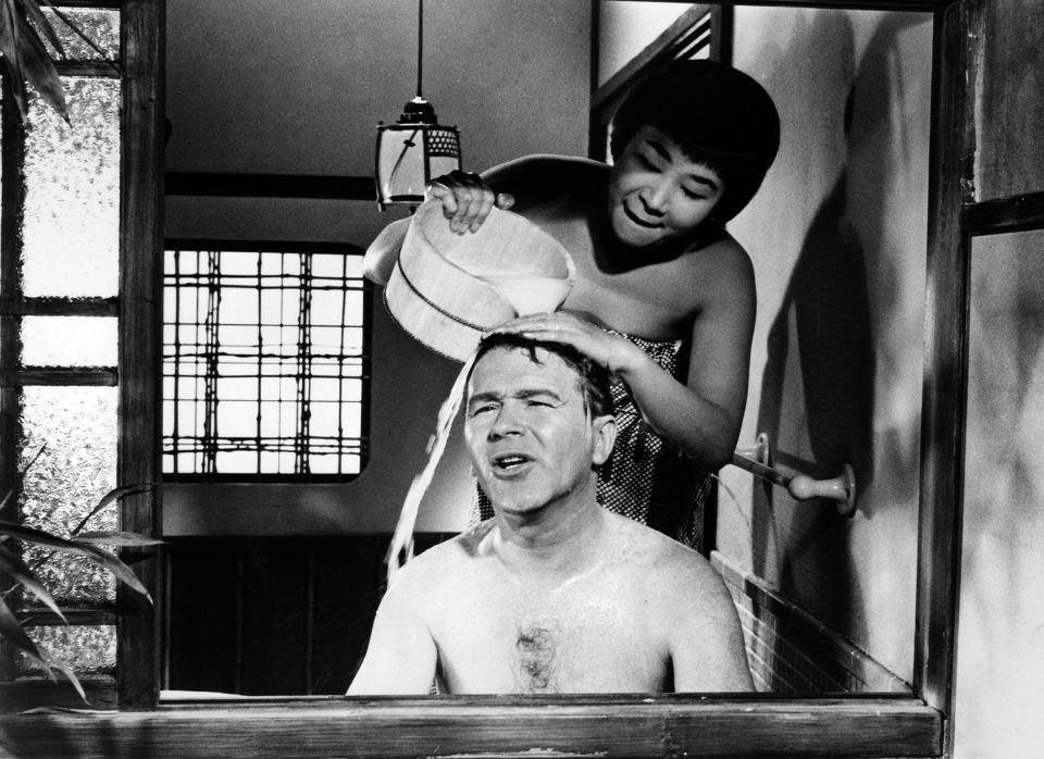 Miyoshi Umeki and Red Buttons in Sayonara, 1957<span class="copyright">Everett Collection</span>