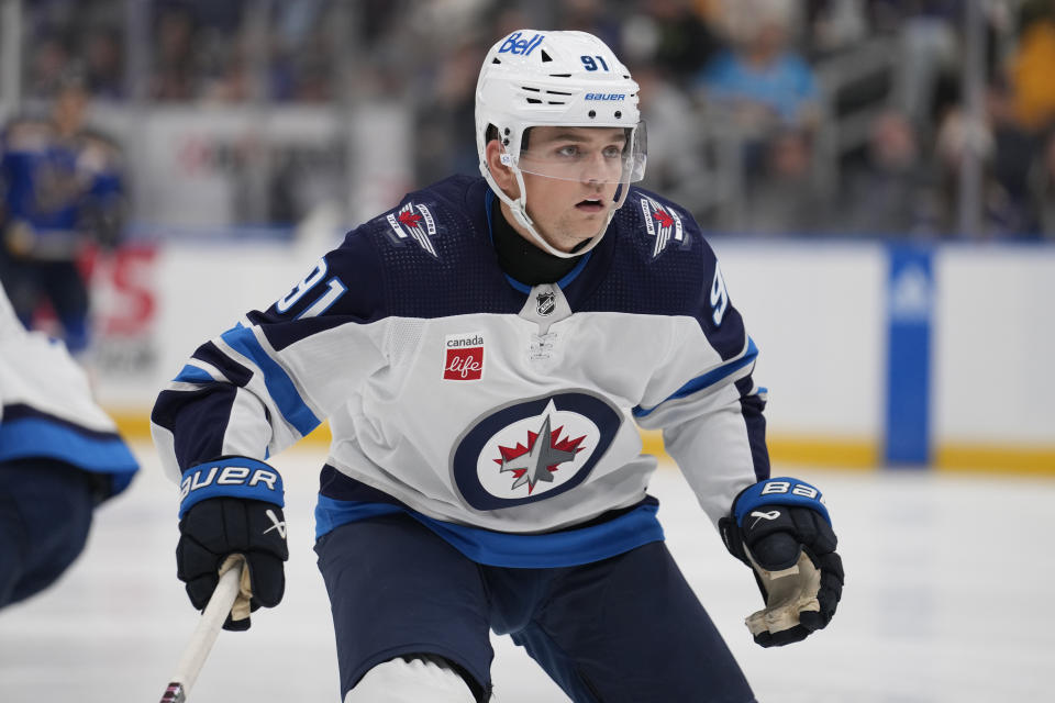 Winnipeg Jets' Cole Perfetti wears a neck guard while playing during the third period of an NHL hockey game against the St. Louis Blues Tuesday, Nov. 7, 2023, in St. Louis. (AP Photo/Jeff Roberson)