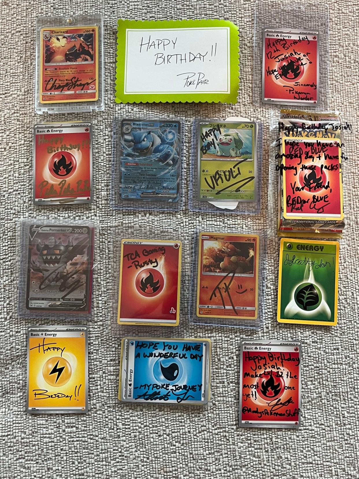 Several YouTube content creators signed Pokémon cards for Jon Santucci's son's birthday.