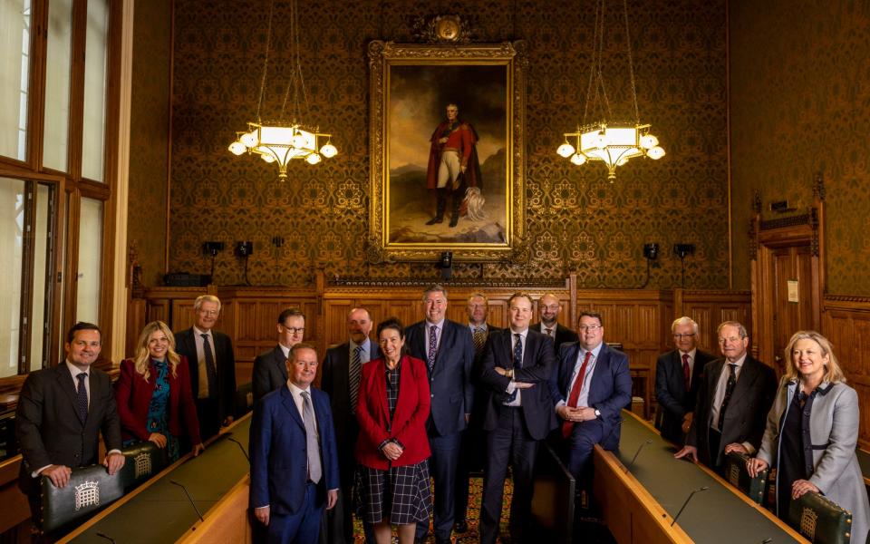 Sir Graham Brady (centre), Chairman of the Executive of the 1922 Committee, with his officers in Committee Room 8