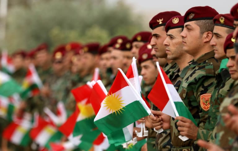 Iraqi Kurdish peshmerga take part in a gathering in regional capital Arbil on September 20, 2017 to urge people to vote in last month's fateful independence referendum